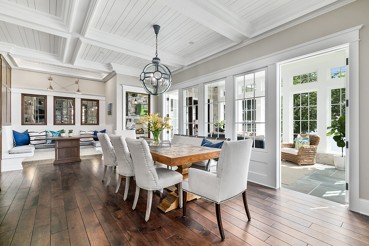 Elegant dining room with coffered ceiling and French doors